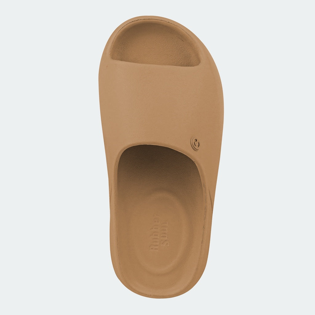 Tan slide sandal on a light gray background